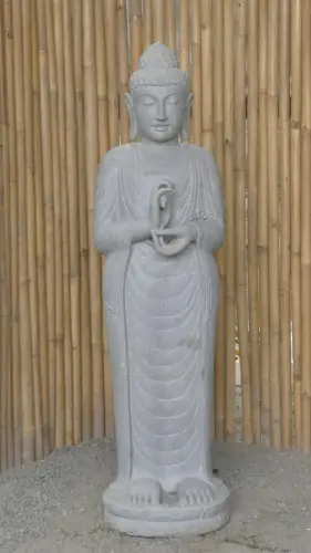 Product image of the product “Standing Buddha made of Riverstone in Dharmachakra position - gesture of wheel of the teaching of Dharma. About 150cm height. ”